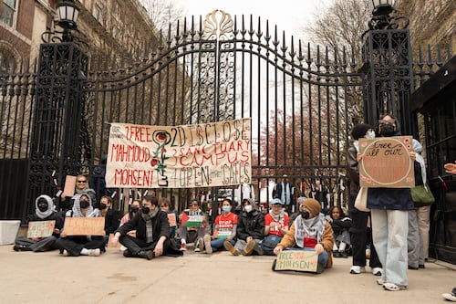Students and alumni tether themselves to 116th and Amsterdam gates in protest of ICE detaining affiliates